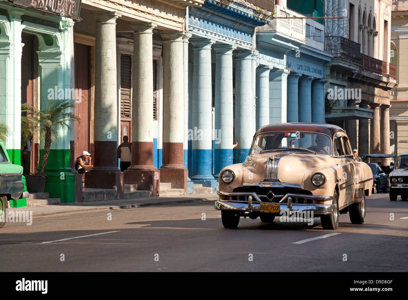 vintage US car from the 50`s and coulourful buildings in Centro Habana, Havana, Cuba, Caribbean Stock Photo